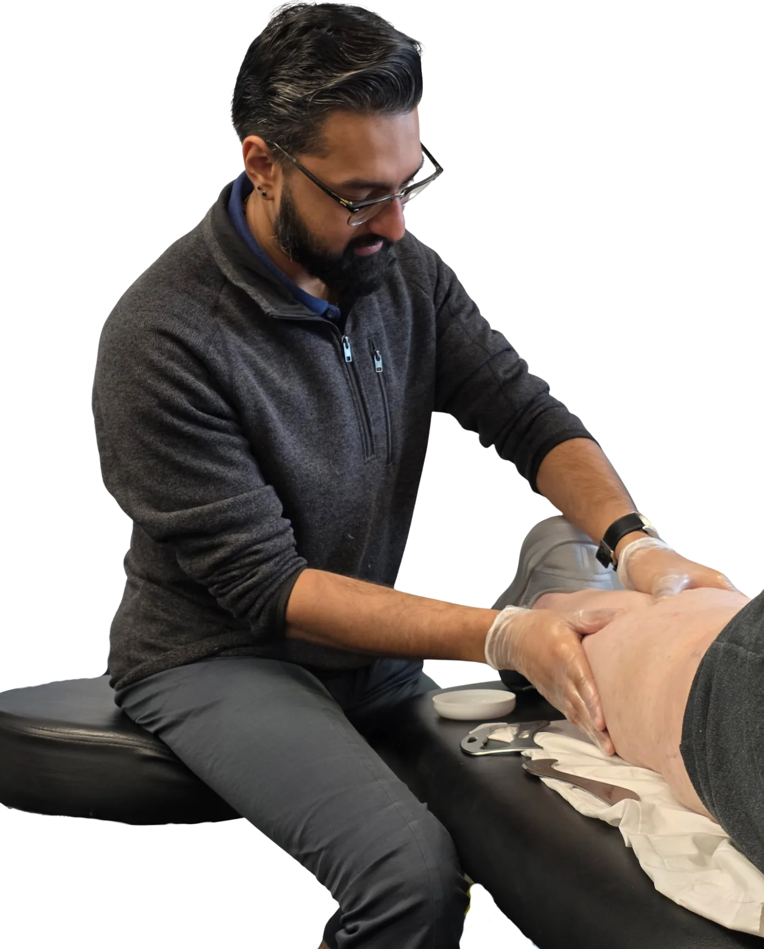 Dr. Raj treating a client in their home